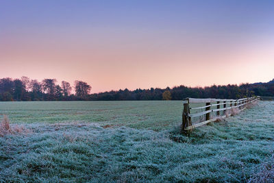 Scenic view of field against sky during sunset