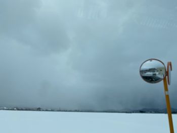 Scenic view of lake against sky during winter