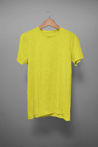 Yellow bell hanging against white background