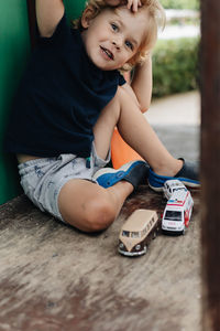 Young boy playing with the toys 