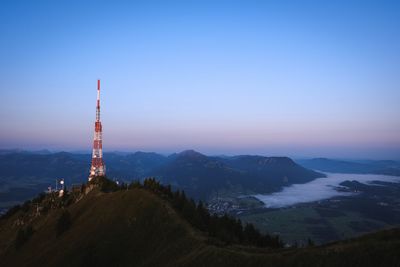 View of tower and buildings against sky