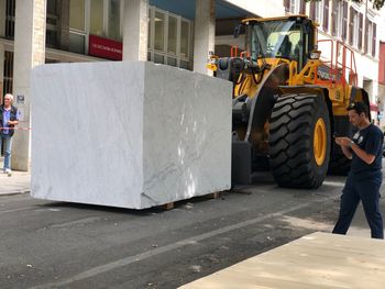 People working on street in city