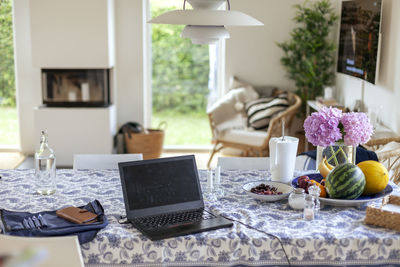 Laptop on dining table