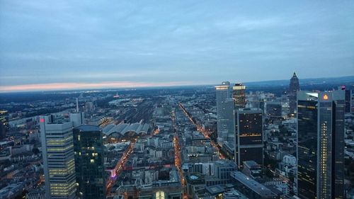 High angle view of cityscape against cloudy sky