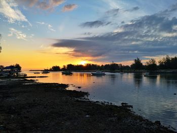 Scenic view of lake against sky during sunset