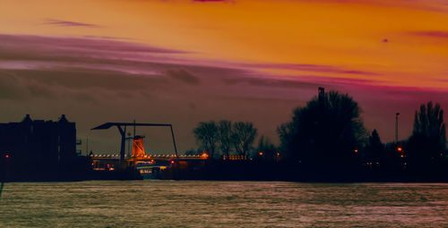 Scenic view of sea against orange sky