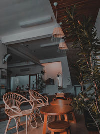 Empty chairs and tables in restaurant