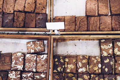 Directly above shot of chocolate brownies for sale at bakery