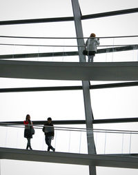 Man standing on railing