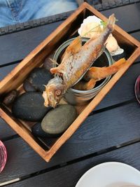 High angle view of fish on barbecue grill