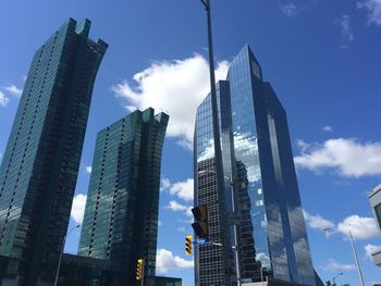 Low angle view of modern buildings against sky