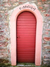 Closed door of red wall