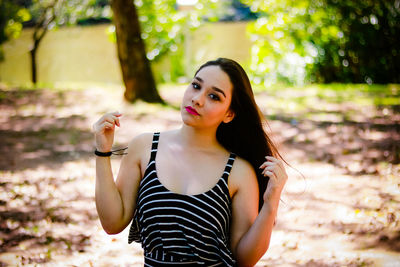 Portrait of fashionable young woman outdoors