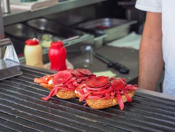 Close-up of man preparing food on table