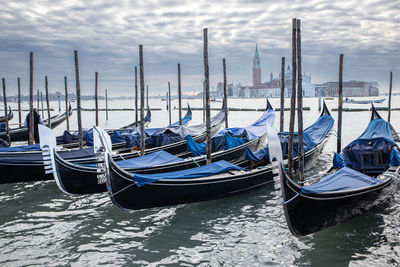 Boats moored at harbor