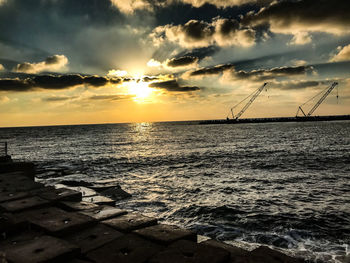 Scenic view of sea against sky during sunset