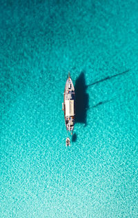High angle view of ship against clear blue sky