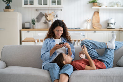 Young woman using laptop at home