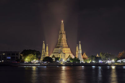 Illuminated buildings in city at night