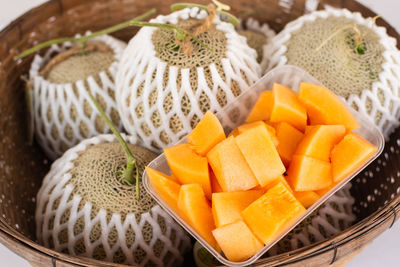 High angle view of fruits in basket on table