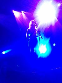 Low angle view of tree against blue sky