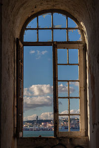 Sea seen through window of old building