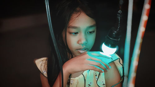 Close-up of young woman using mobile phone