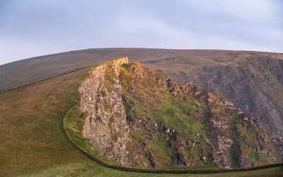 View of landscape against mountain range