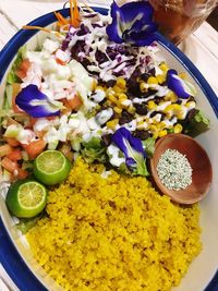 High angle view of chopped fruits in bowl on table