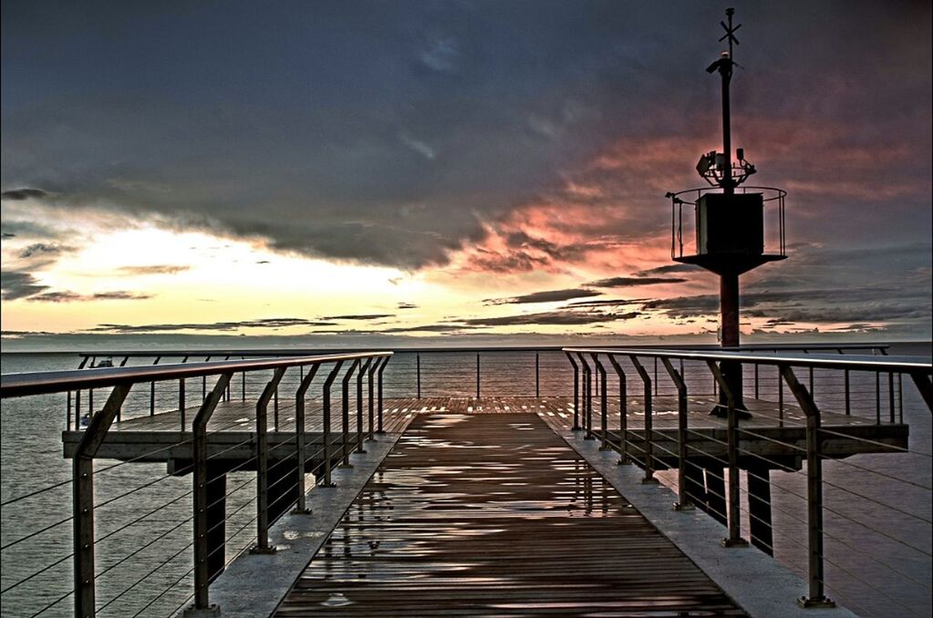 water, sea, sky, the way forward, sunset, pier, cloud - sky, railing, built structure, scenics, tranquility, tranquil scene, horizon over water, beauty in nature, architecture, nature, jetty, diminishing perspective, cloudy, idyllic
