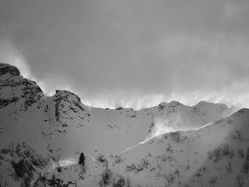 Scenic view of mountains against sky during winter