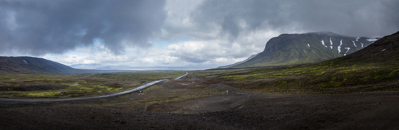 Panoramic view of road amidst mountains against sky