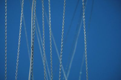 Close-up of chains against clear blue sky