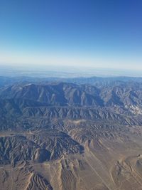 Aerial view of dramatic landscape against clear sky