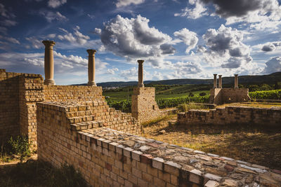 Old ruin building against cloudy sky