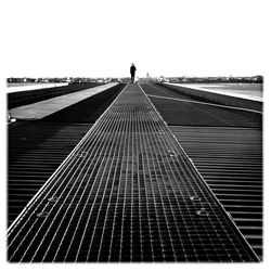 Woman walking on road