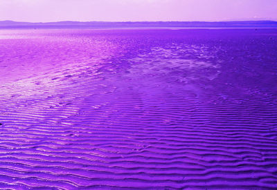 Scenic view of pink sea against sky