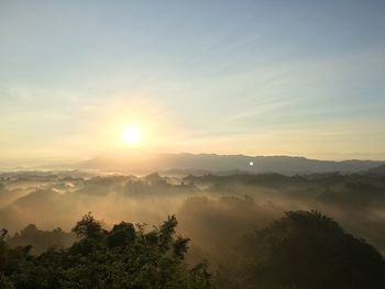 Scenic view of landscape against sky during sunset