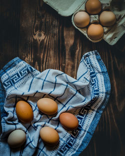 High angle view of eggs in basket on table