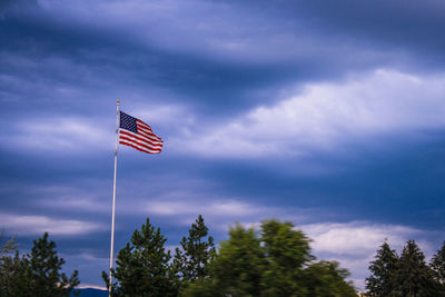 Low angle view of flag against sky