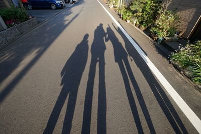 Shadow of people on street