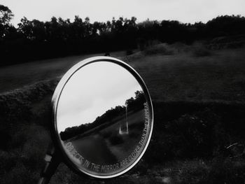 Reflection in side-view mirror of vehicle