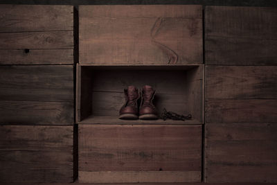 Low section of woman sitting on wooden floor