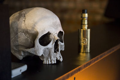 Close-up of a skull on table