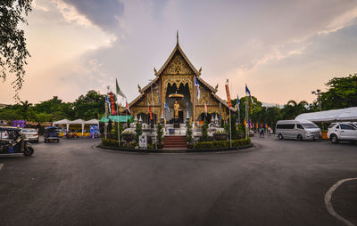 Panoramic view of city street and buildings against sky