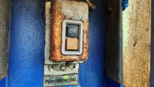 An old and rusty emergency stop button at power plant