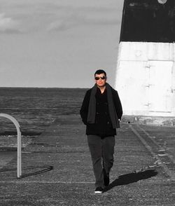 Portrait of man standing in sunglasses