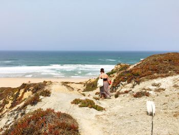 Rear view of people on beach