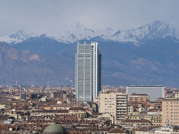 Modern buildings in city against sky