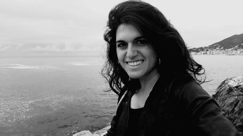 Portrait of smiling young woman on beach